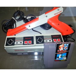 console nintendo avec 2 manettes + pistolet +1 jeu